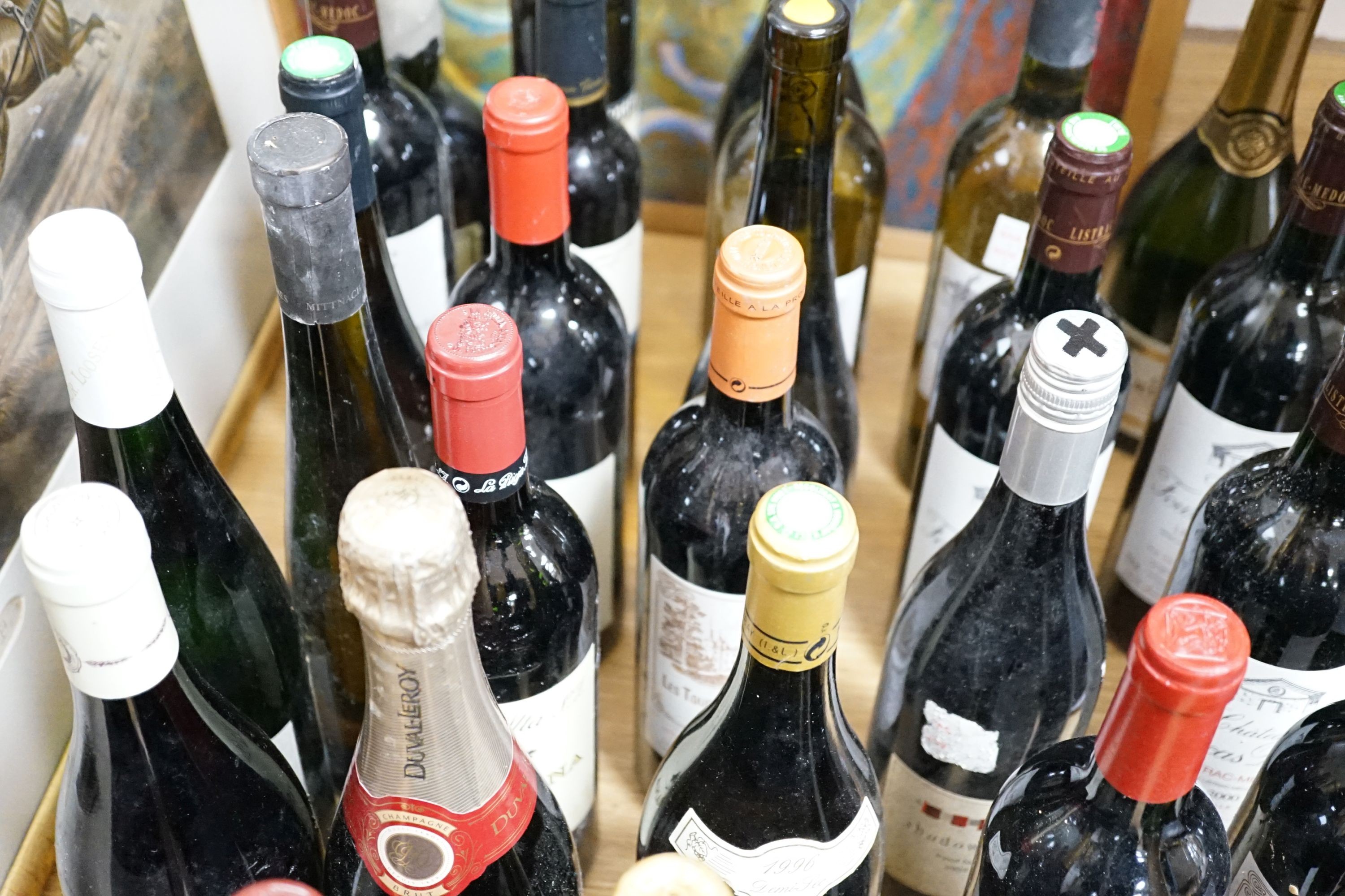 Twenty nine assorted bottles of wine is etc. including Les Tourelles de Longueville, 2003, Chateau Fourcas Dupre, 2000, Perrier Jouet Grand Brut Champagne, Chateau Sigognac, 1985 and Cote Rotie, 2001.